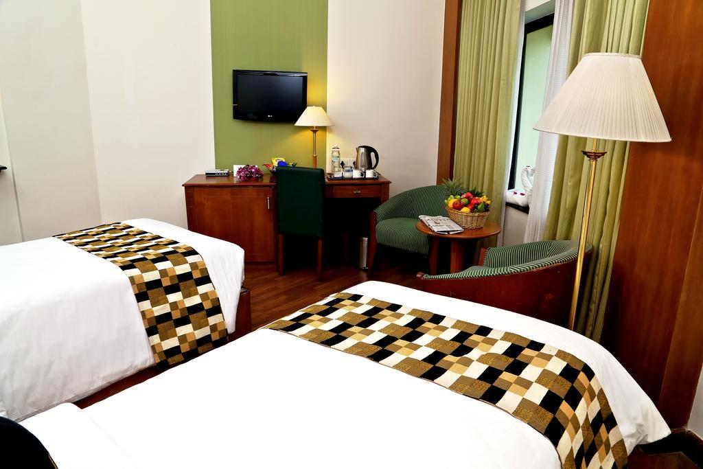 Gokulam Park Hotel y Centro de Convenciones Kochi Habitación foto